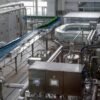 Automatic bottled water and juice filling production line running in a China factory
