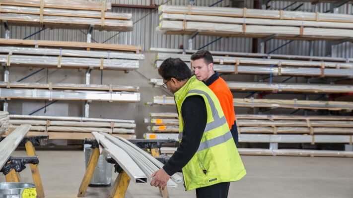 Two people inspecting goods in a warehouse - verifying a China supplier before paying, for Bangladesh importers