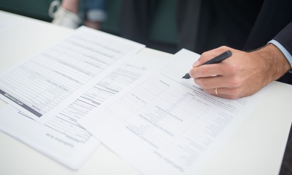 Reviewing supplier registration paperwork during verification