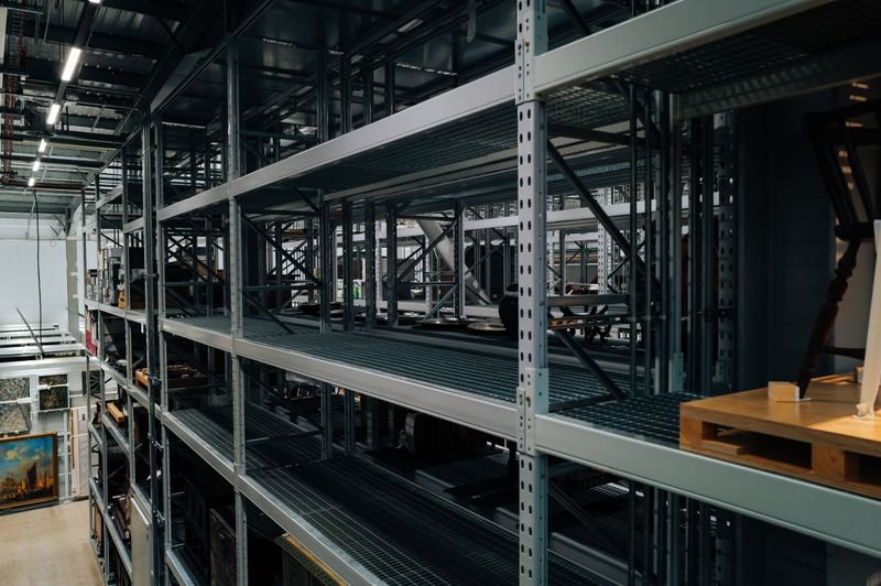 Empty metal storage racks in a spacious warehouse