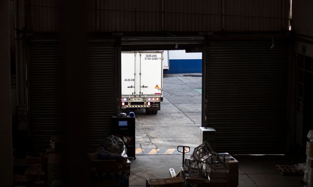 Truck loading at a warehouse dock for door-to-door delivery