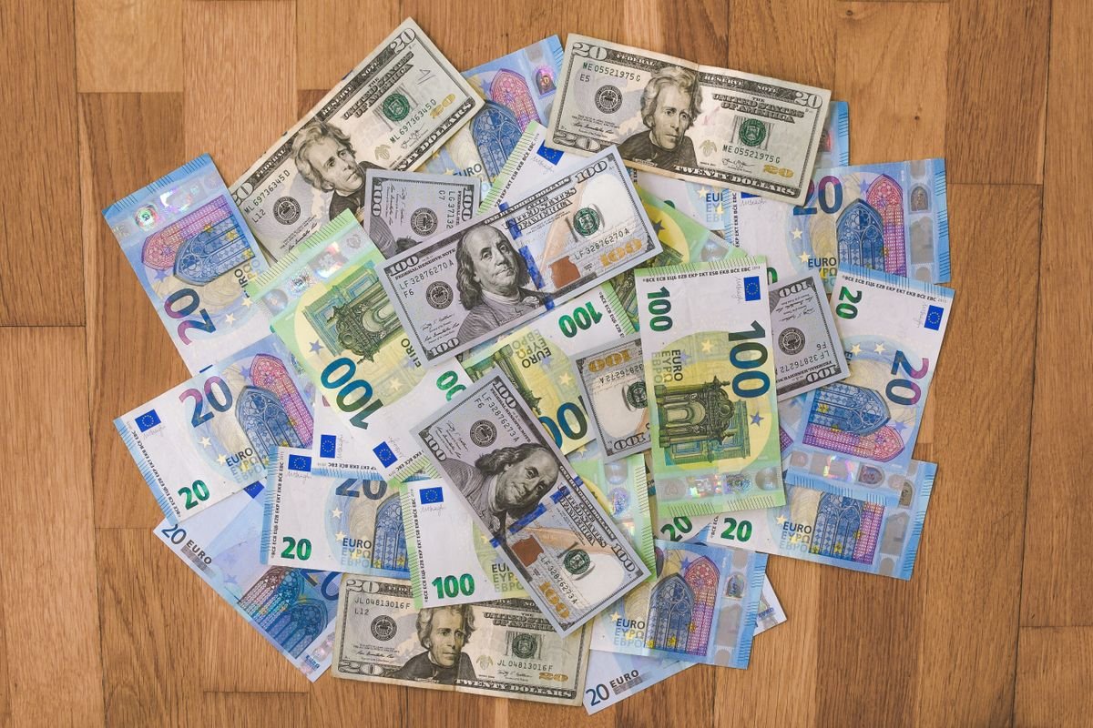 US dollar and Euro banknotes representing international wire transfer