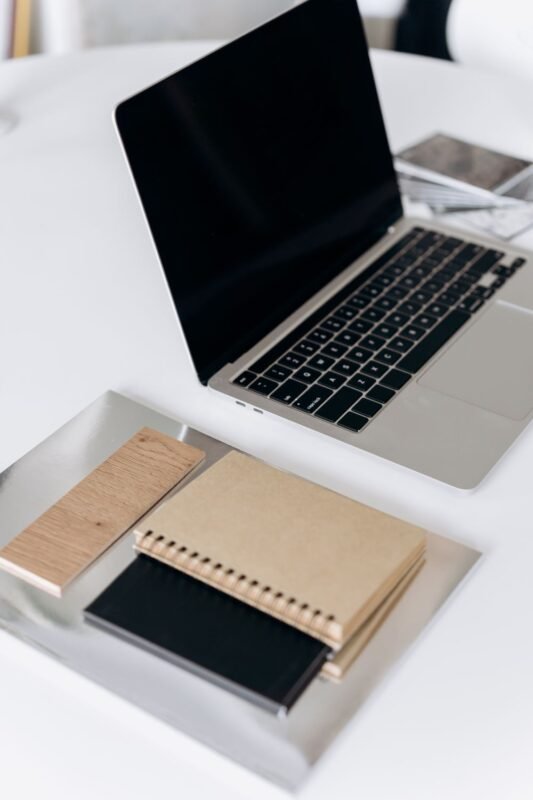 Laptop and notebooks on a desk for planning