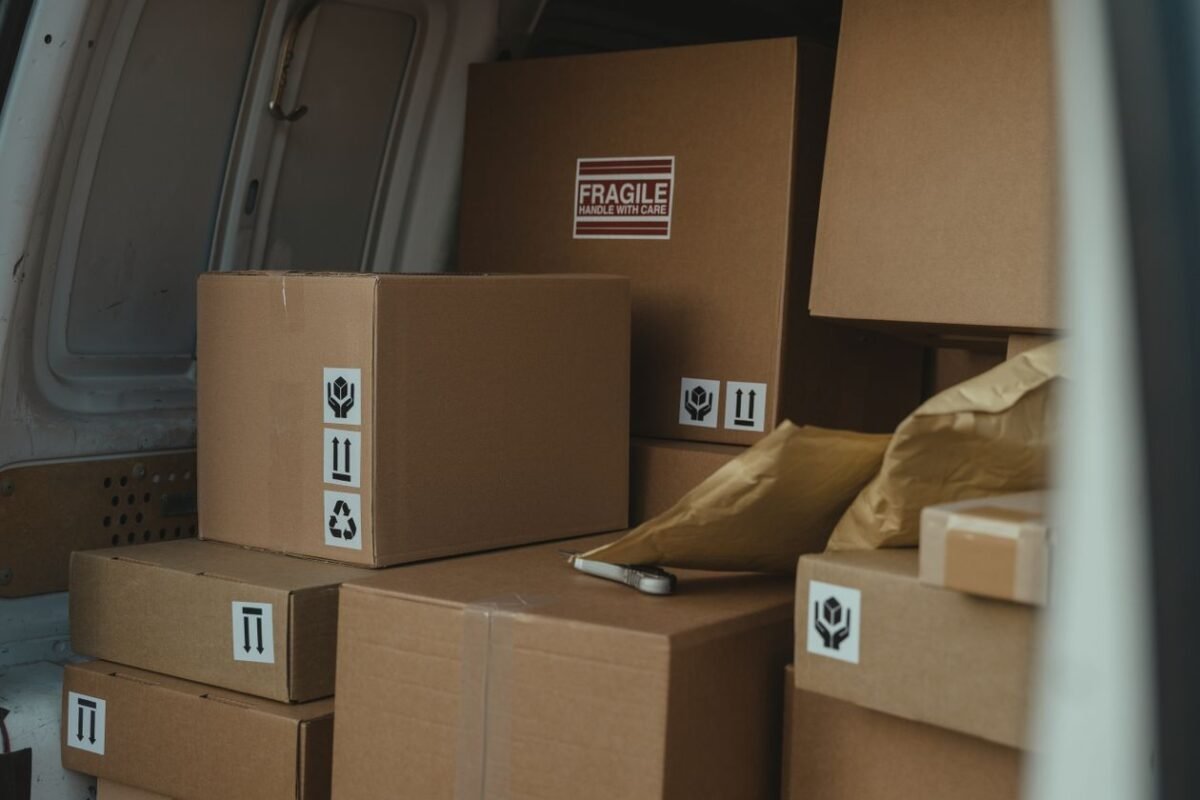 Cardboard parcels with handling labels inside a delivery van