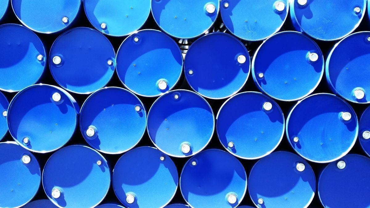 Rows of sealed blue chemical drums
