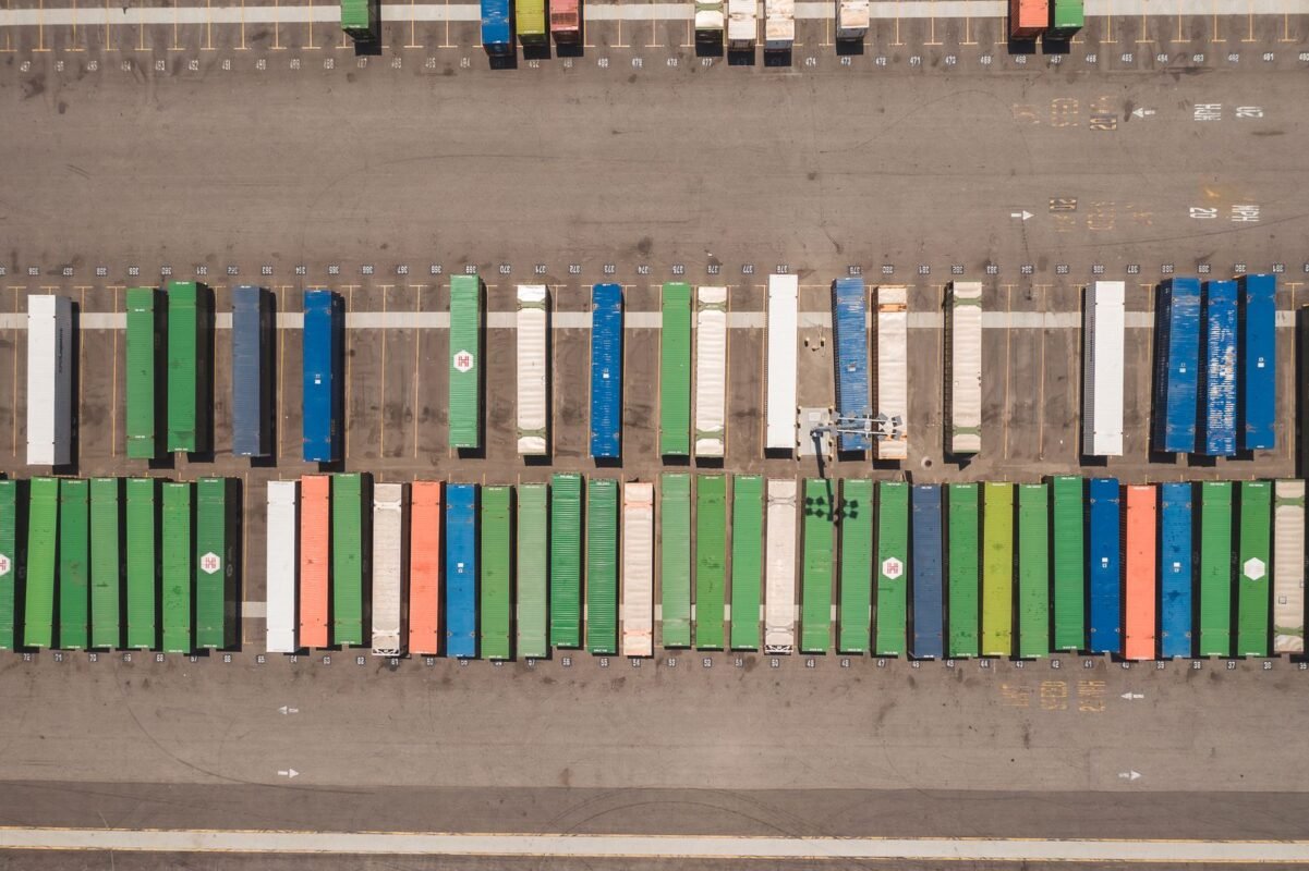 Aerial view of shipping containers parked in numbered depot bays