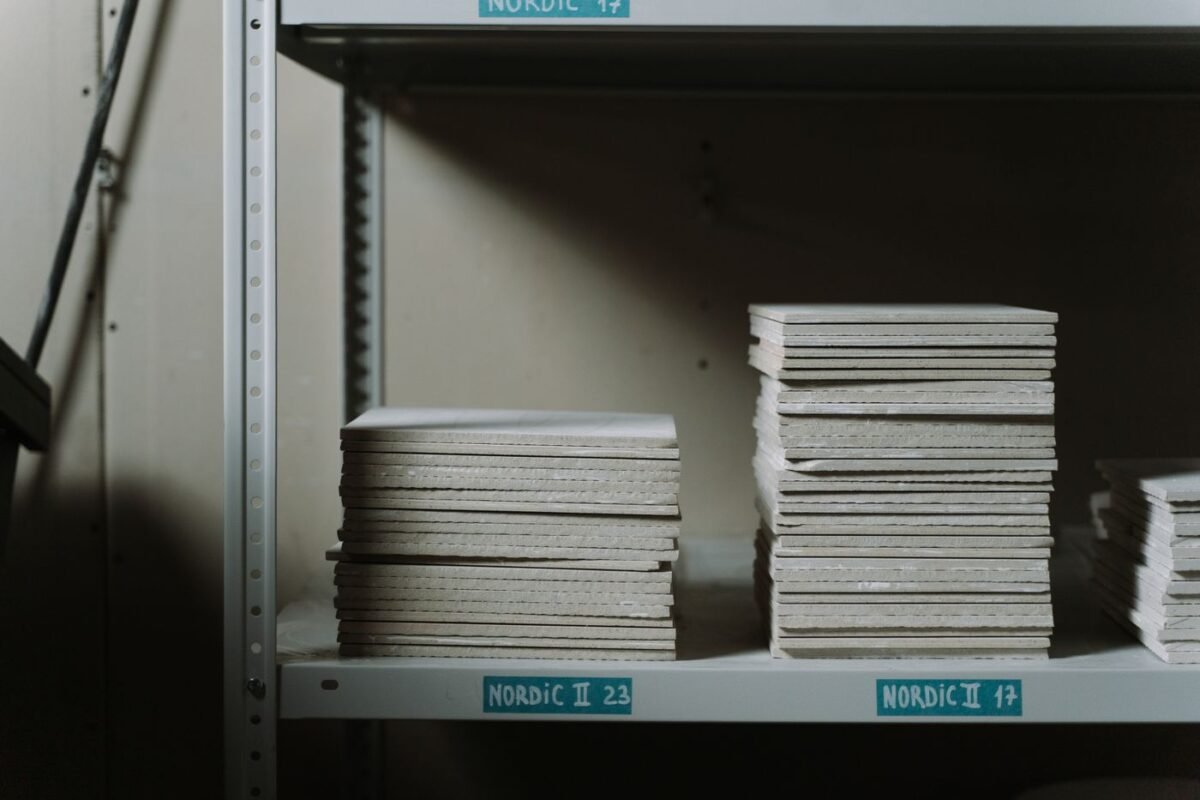 Stacks of ceramic tiles on metal warehouse shelving