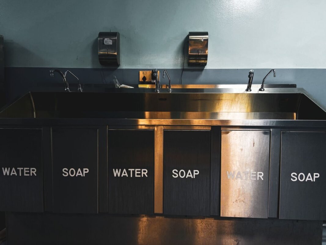 Stainless steel wash station for cleaning and sanitation