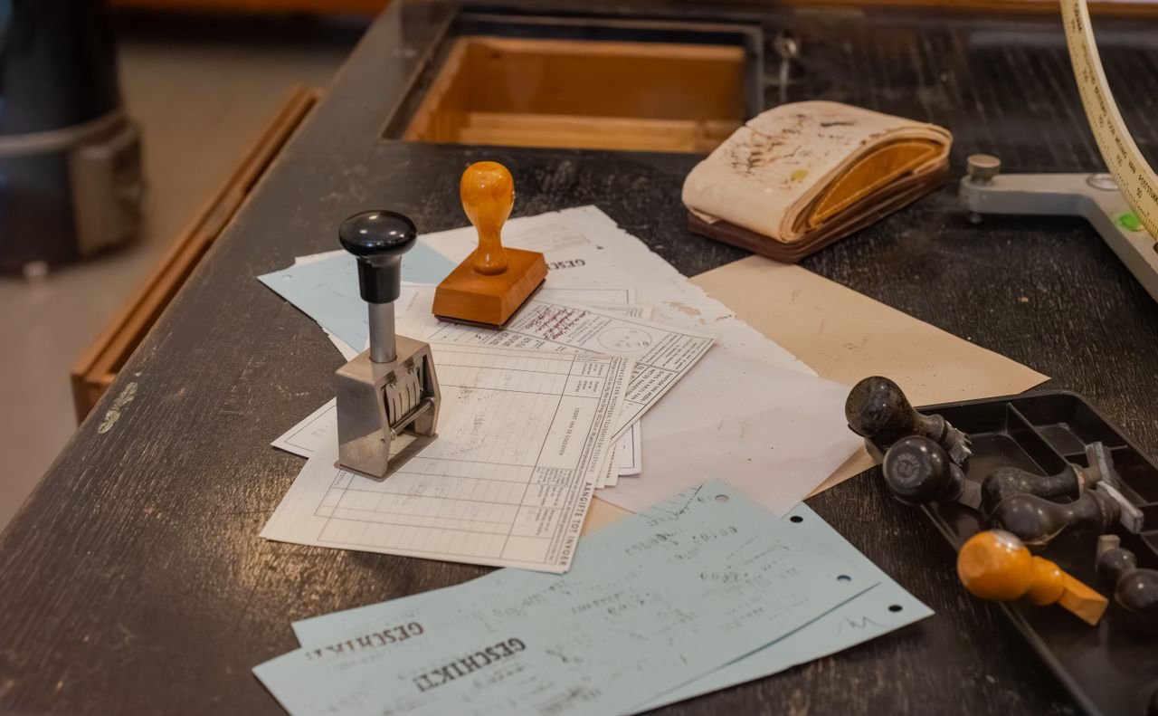 Customs office desk with rubber stamps and import forms