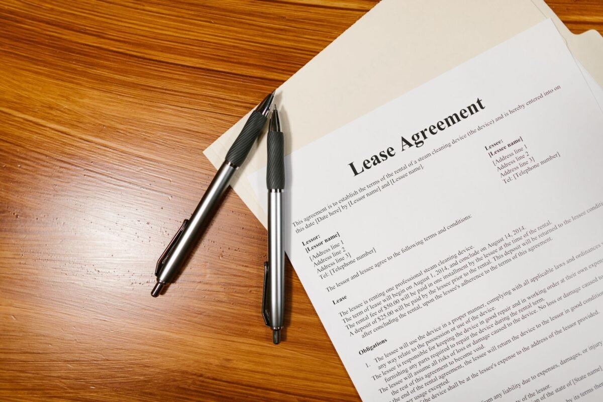 Lease Agreement Document with Pens on Desk