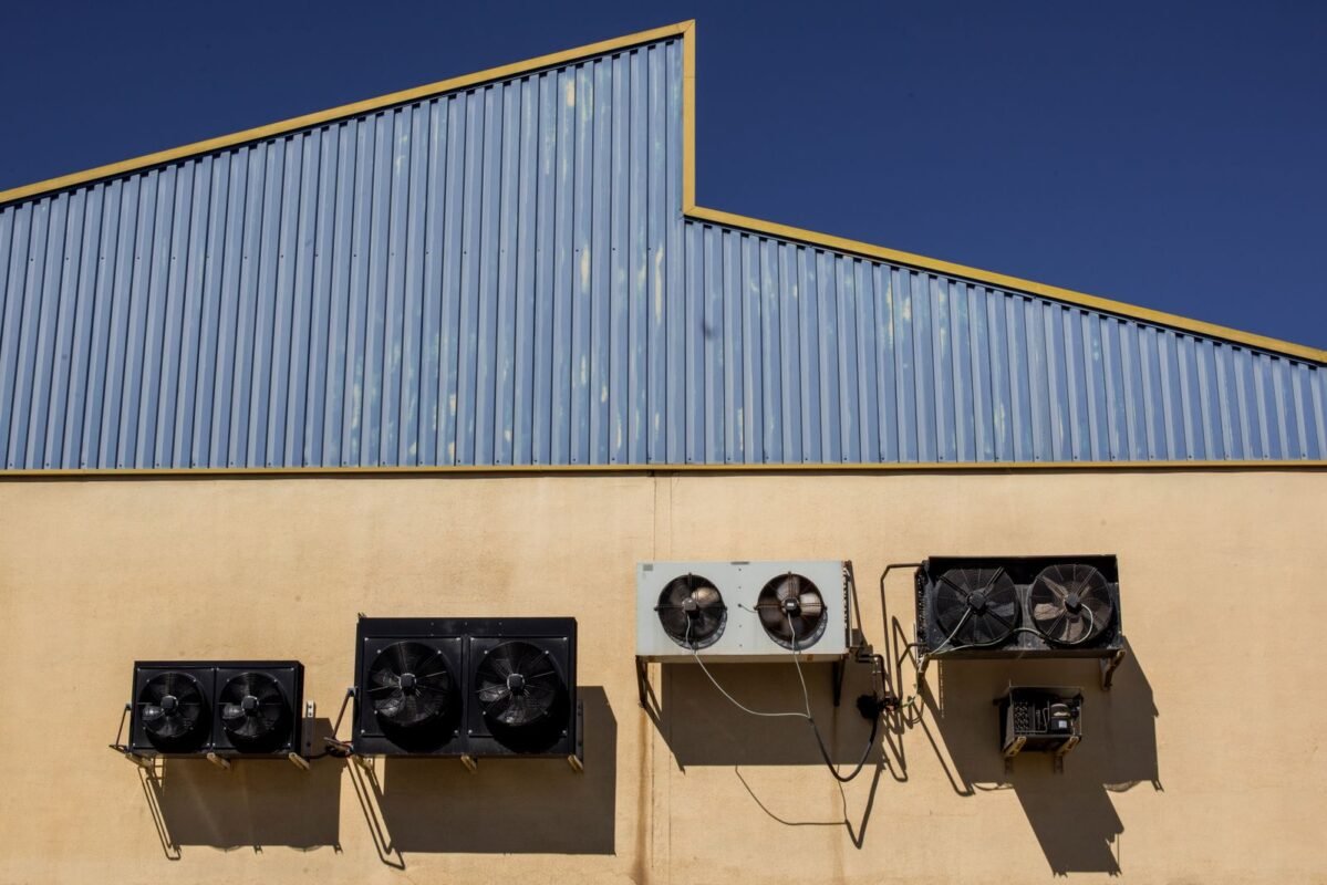 Industrial Condenser and Refrigeration Units on Warehouse Wall