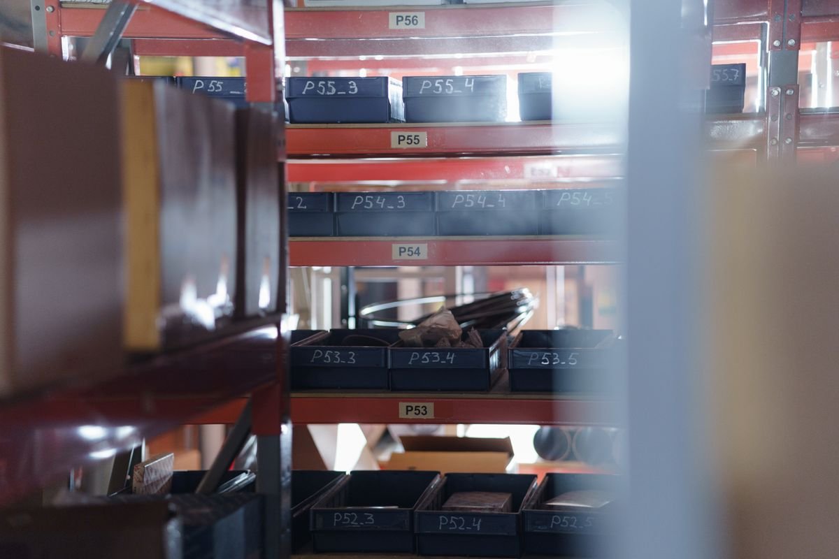 Warehouse shelving with numbered bin location labels