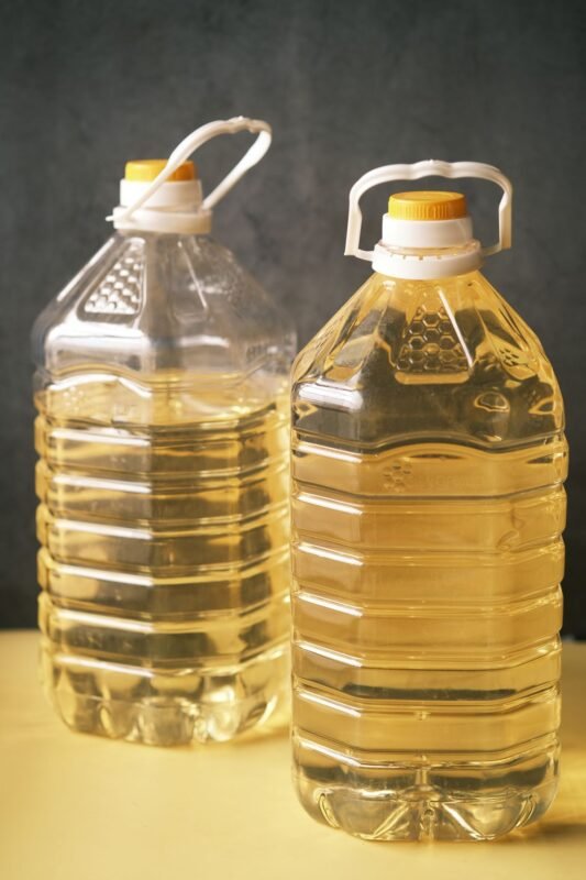 Freshly pressed edible oil filled in clear plastic bottles