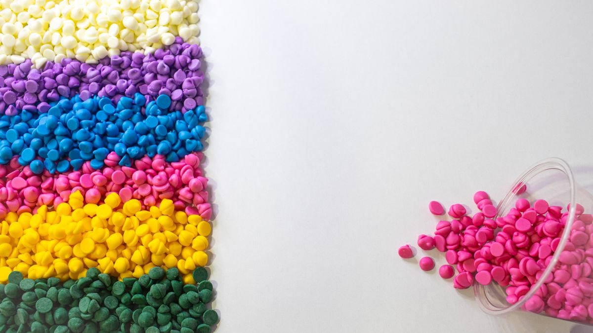 Coloured plastic pellets used as raw material for injection molding