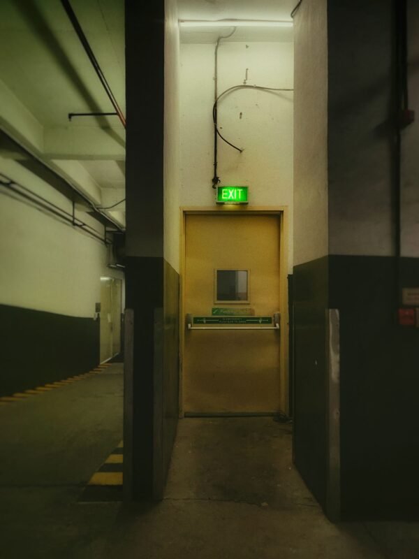 Emergency exit door with push bar in an industrial building