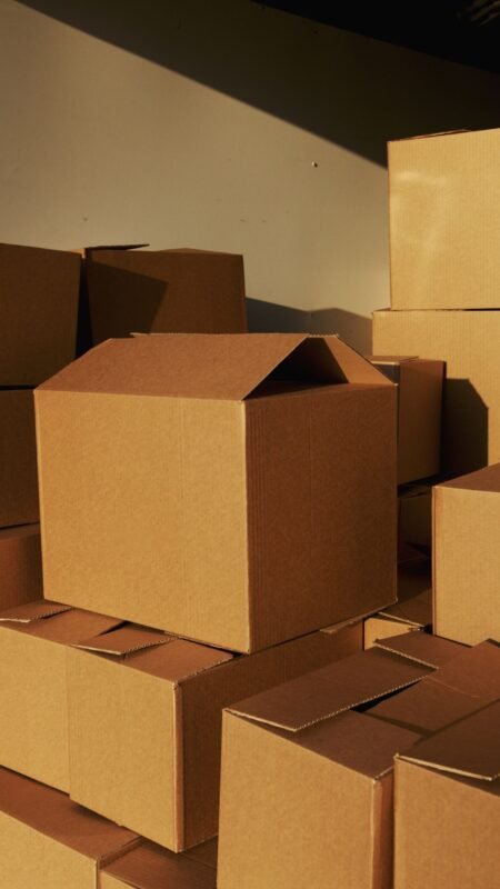 Stacked corrugated cartons in a storage area