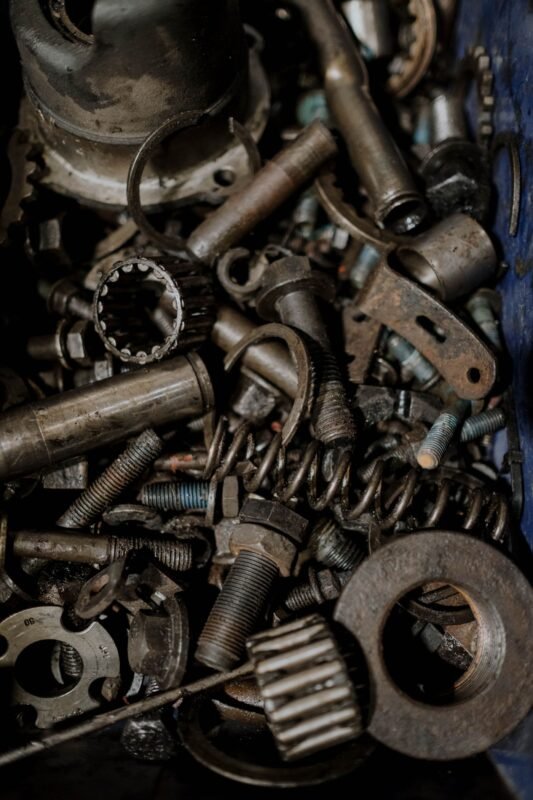 Bin of used machine spare parts, bearings and bolts
