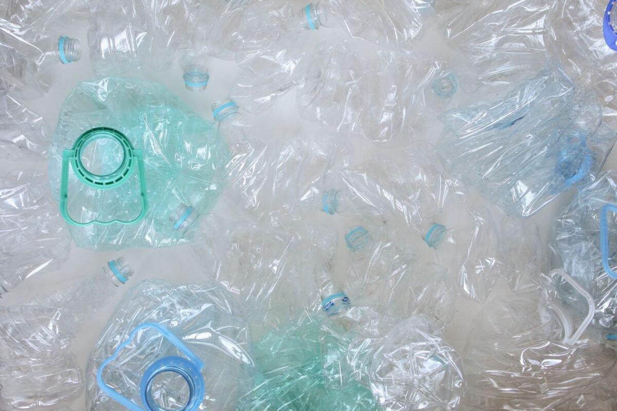 Crushed clear PET plastic bottles ready for a crusher