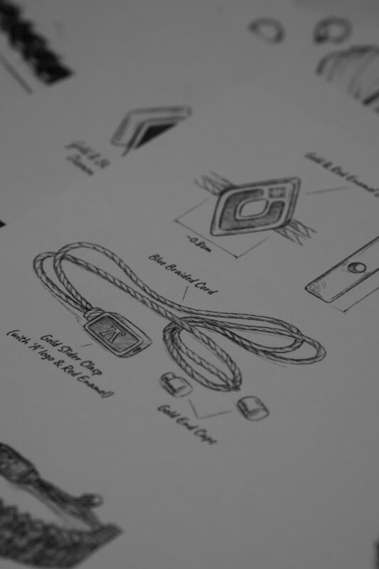 Annotated product design sketch with logo detail