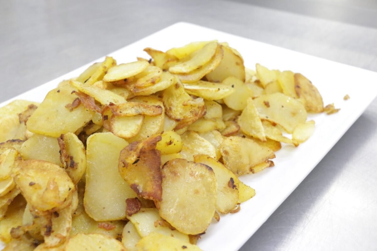 Plate of golden fried potato slices