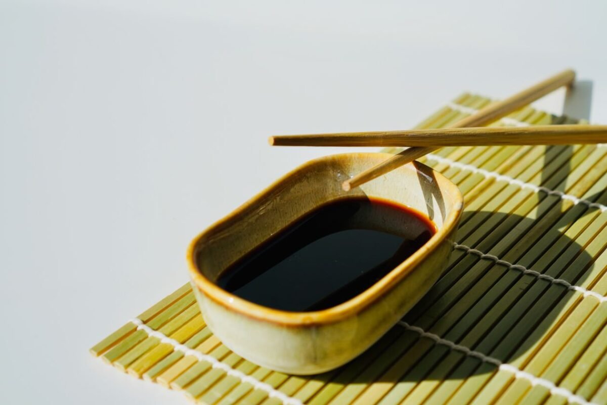 Bowl of dark soy sauce coloured with caramel colour